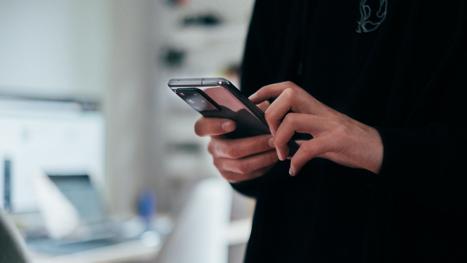 person holding black android smartphone